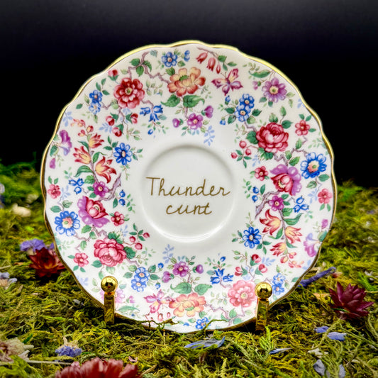 'Thunder Cunt in the garden" (profanity plate)