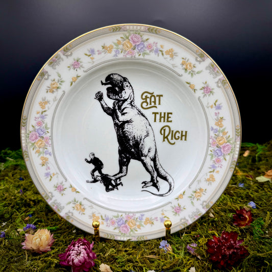 'Dino Eats CEOs,' (8.5 in plate)